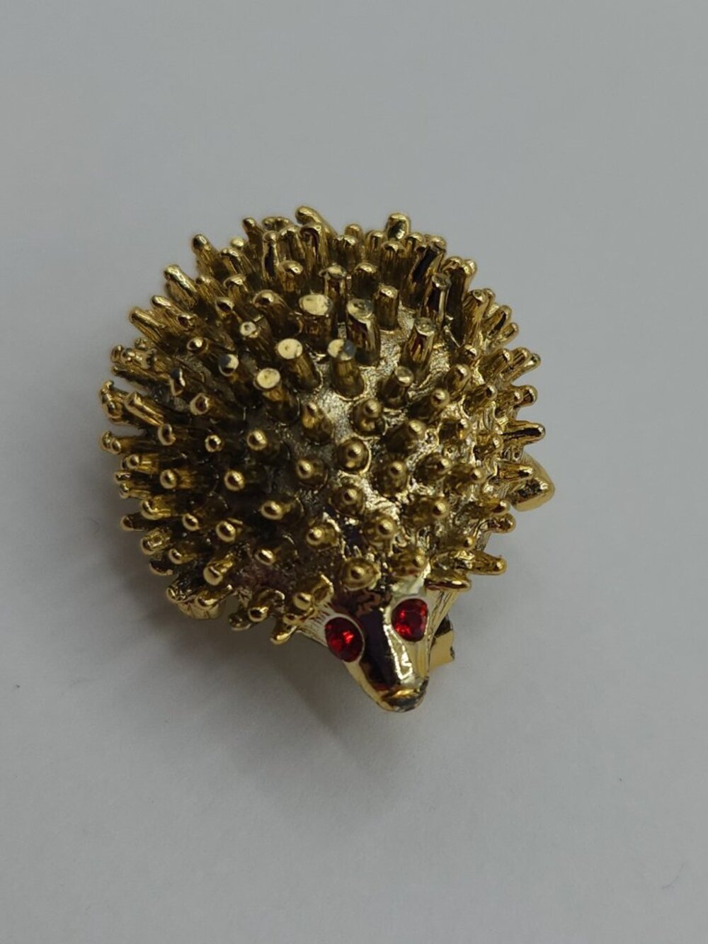 Vintage Gold Tone Hedgehog Brooch with Red Stone Eyes